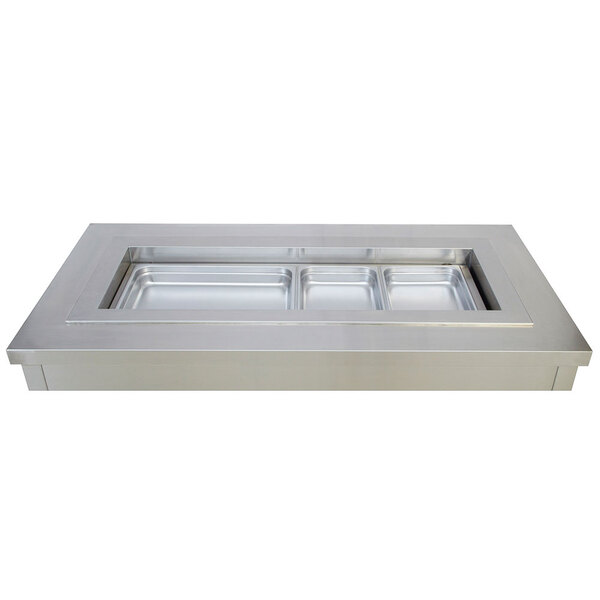 A Wells drop-in cold food well with recessed rectangular pans on a counter.