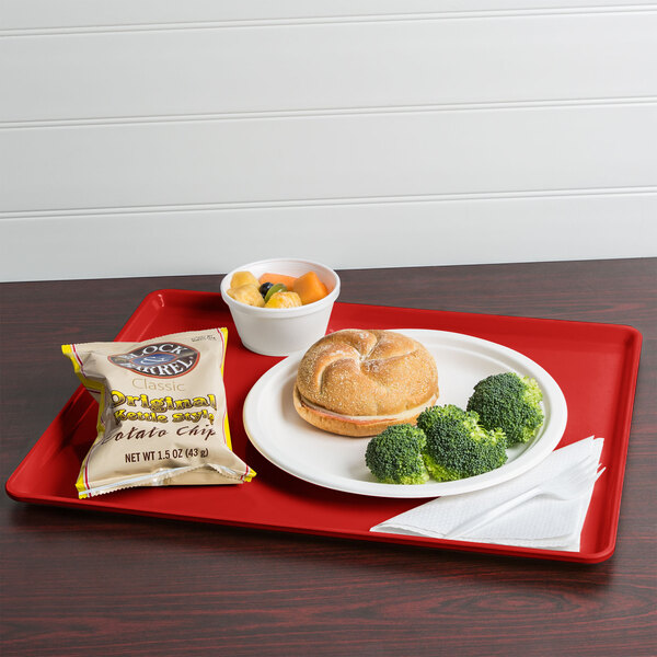 A Cambro dietary tray with food and a drink on it.