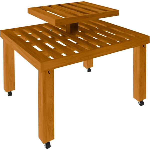 A Marco Company honey pine wood slat table with wheels.