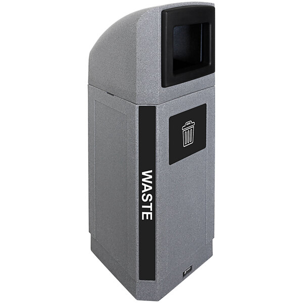 A grey rectangular Busch Systems decorative outdoor waste receptacle with a black lid.