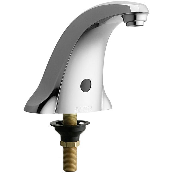 A Chicago Faucets hands-free electronic faucet with a brass handle and spout.