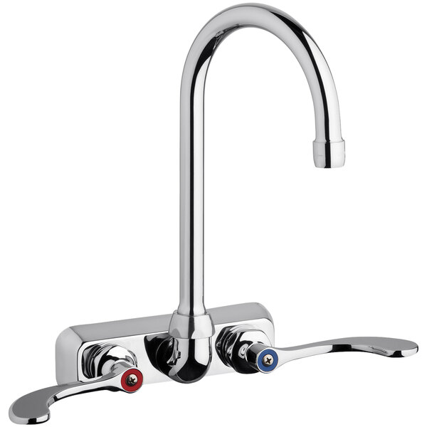 A chrome Chicago Faucets wall-mounted faucet with two gooseneck spouts and red and blue knobs.
