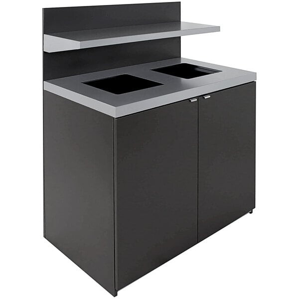 A black and grey Busch Systems Sessanta decorative waste receptacle with two rectangular windows.