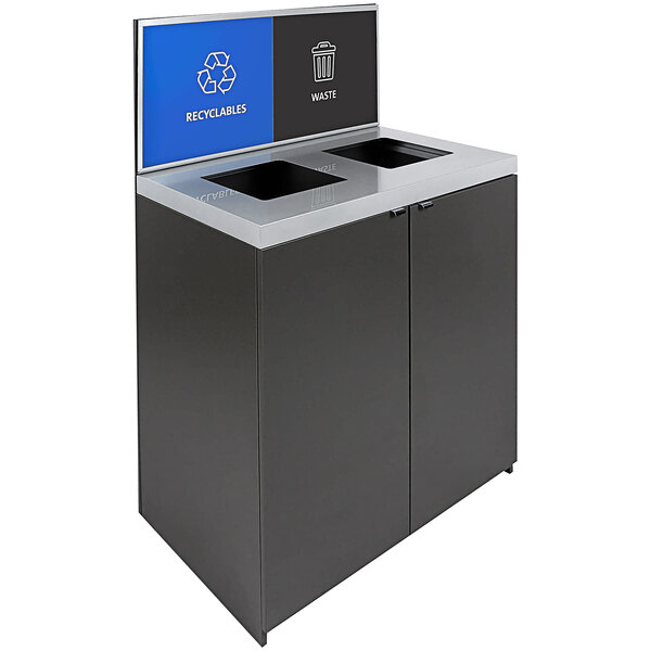 A black and grey rectangular Busch Systems Sessanta two-stream recycling bin with blue and silver signage.