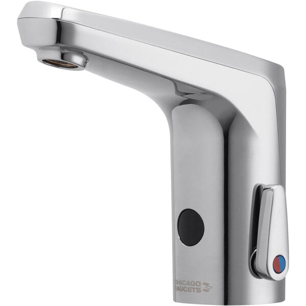 A silver Chicago Faucets touchless faucet with a red button on the side.
