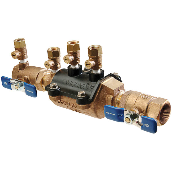 A Zurn brass double check valve with two blue handles.