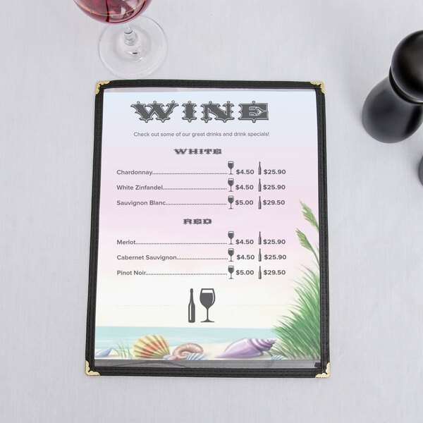 A menu with a seafood themed coral design on a table with a glass of wine.