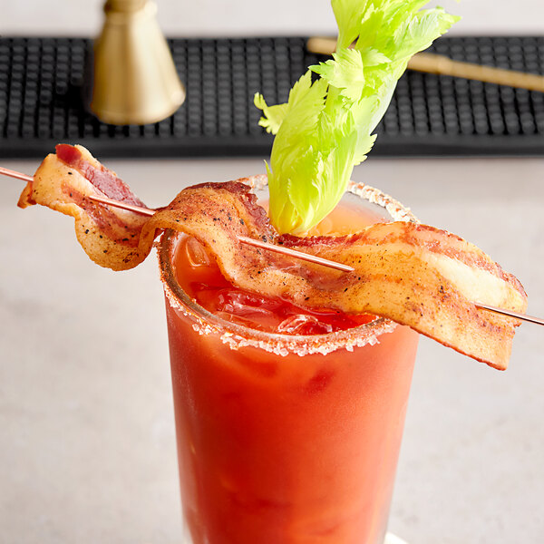 A bloody mary with a Riff's Smokehouse Red Curry Bacon on a stick.
