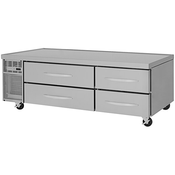A stainless steel Turbo Air chef base with four drawers on wheels.