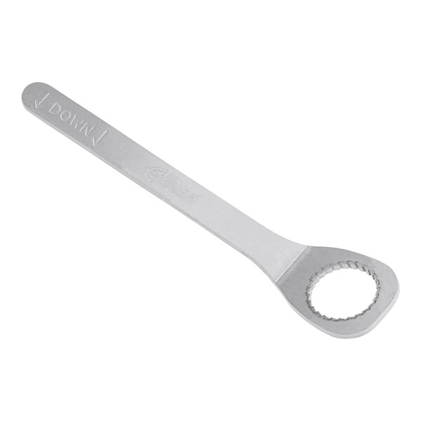 An Edlund stainless steel wrench with a round end.
