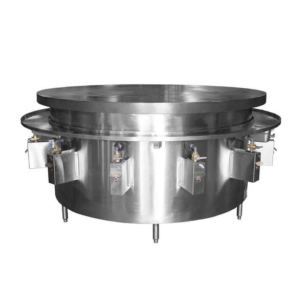 A Town natural gas Mongolian BBQ range with a large round metal top over four metal plates.