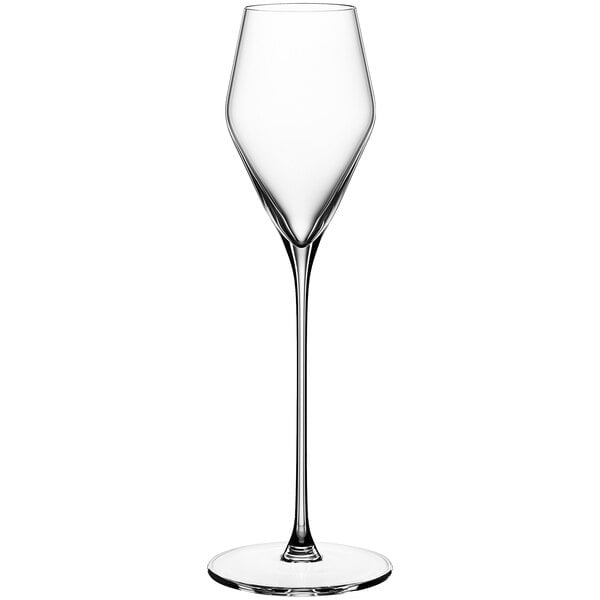 A close-up of a clear Spiegelau dessert wine glass with a long stem.