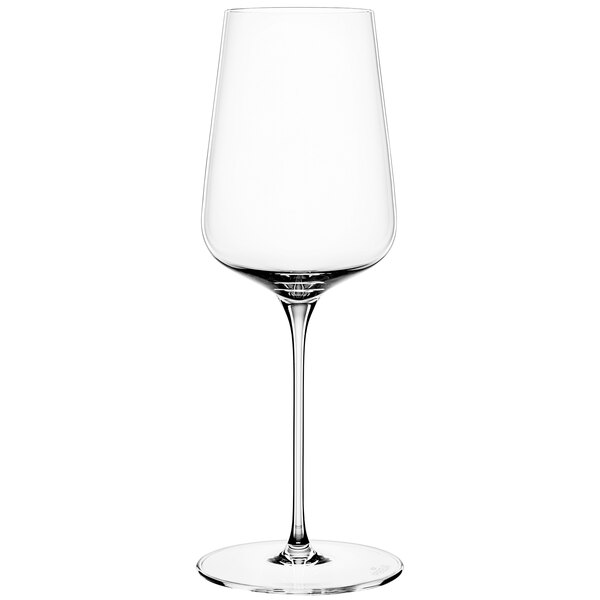 A close-up of a clear Spiegelau white wine glass with a long stem.