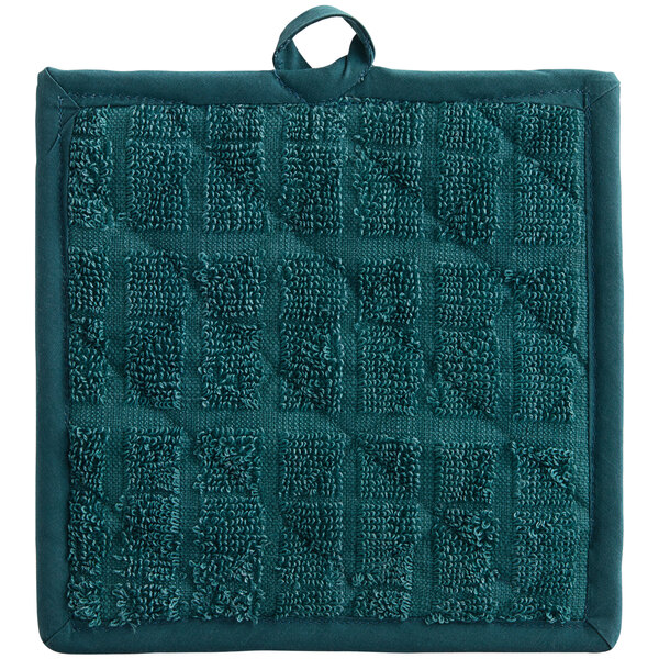 A hunter green square shaped pot holder with a small square design.