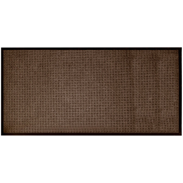 A close-up of a brown rectangular Stop-N-Dry entrance mat with a black border.