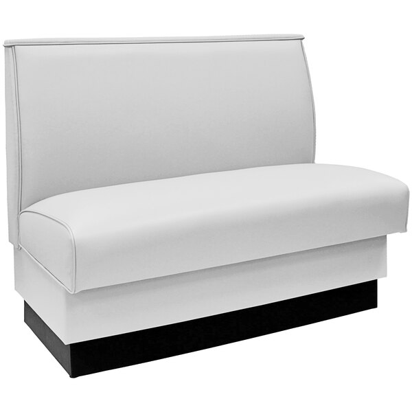 An American Tables & Seating white fully upholstered booth with a black base.