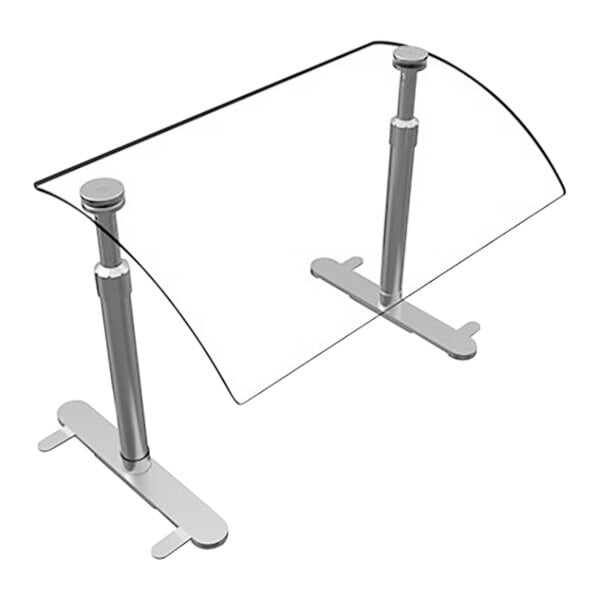 A Hatco curved acrylic sneeze guard on a glass table.