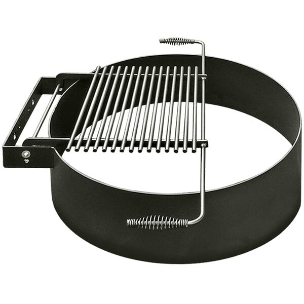 A round metal fire pit ring with a black flip grill grate.
