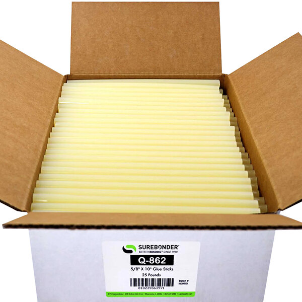 A white box with a green and white label containing many white Surebonder low temperature glue sticks with yellow ends.