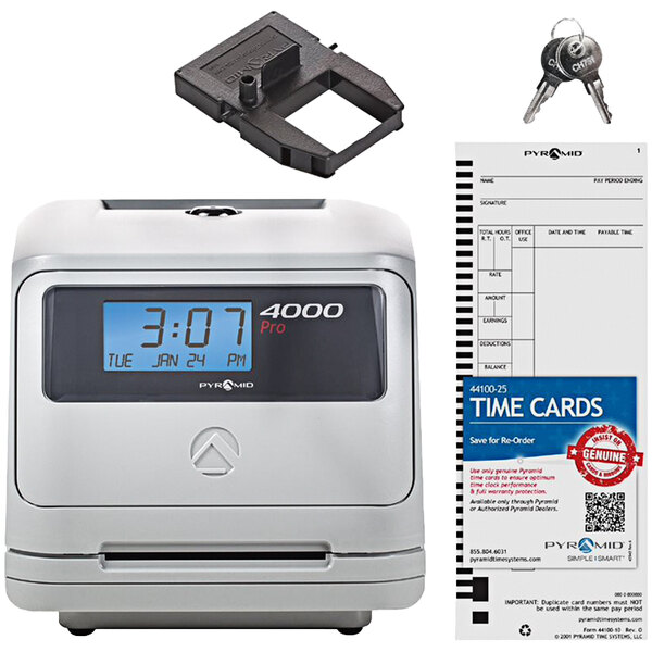 A light gray rectangular electronic time clock with a black screen and a key holder.