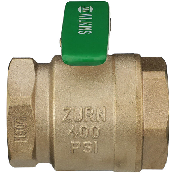 A close-up of a Zurn brass ball valve with a green handle.