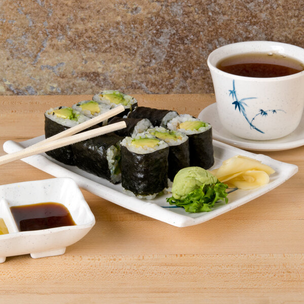 A Thunder Group Blue Bamboo rectangular melamine plate with sushi, chopsticks, and soy sauce.