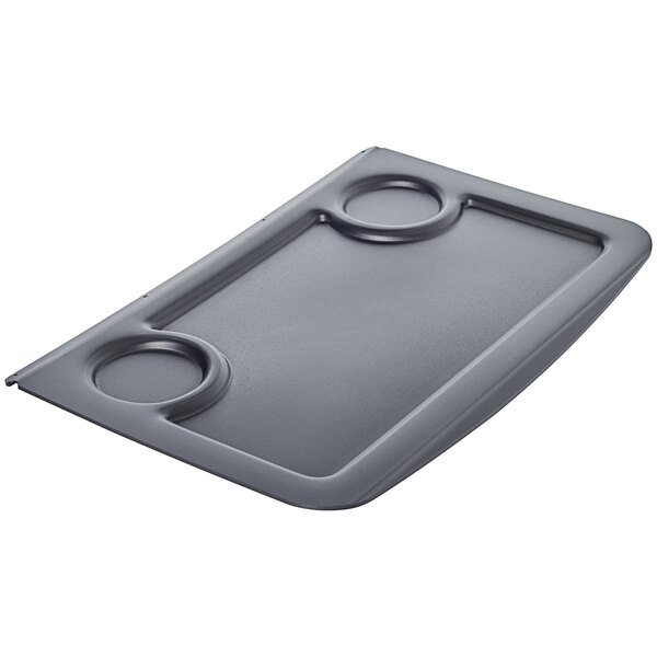A black rectangular Rubbermaid waste lid with two circles on it.