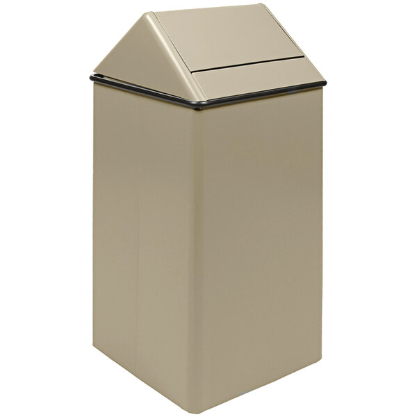 A tan rectangular Witt Industries decorative trash can with a swing top lid.