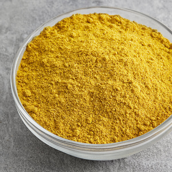 A bowl of McCormick Culinary Curry Powder.