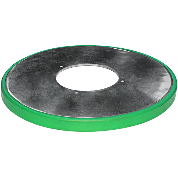 A white circular disc with a green rim and a circular metal object with a green band.