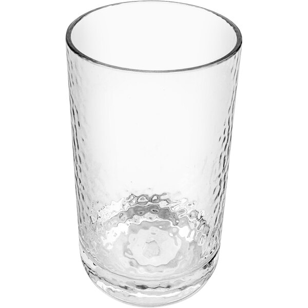A clear plastic highball glass with a white rim.
