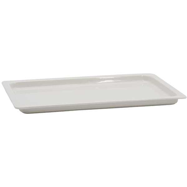 A white rectangular porcelain dish with a handle.