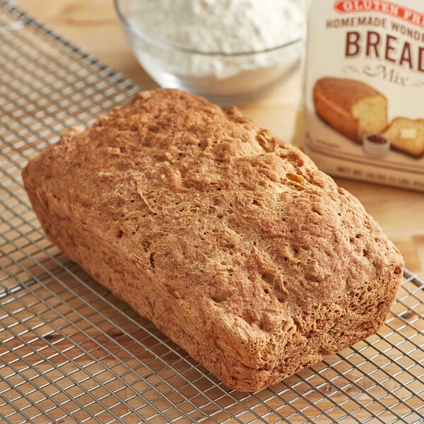 A loaf of Bob's Red Mill gluten-free bread on a cooling rack.