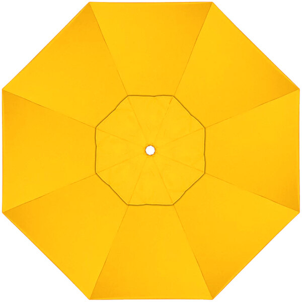 A yellow California Umbrella canopy with a white center and a hole in the center.