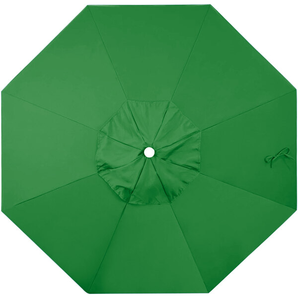 A green umbrella canopy with a white button.