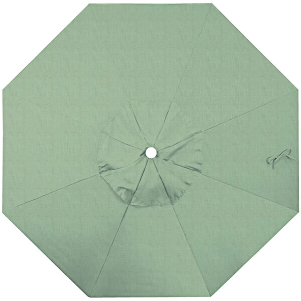 A green California Umbrella canopy with a hole in the middle.