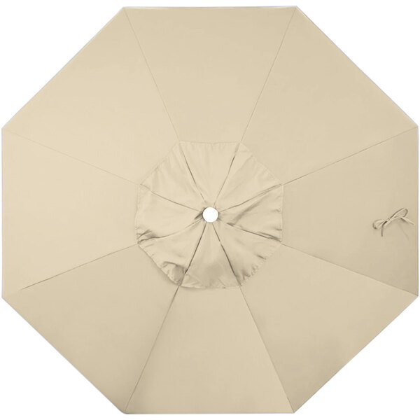 A close-up of a beige open California Umbrella.