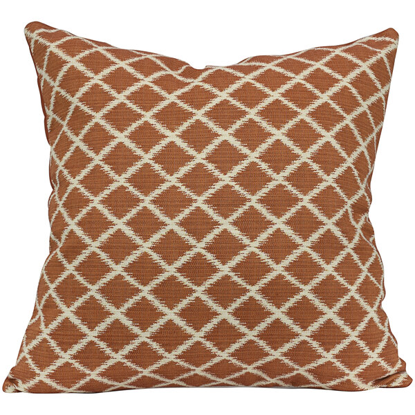 An Astella apricot and white outdoor throw pillow with a geometric pattern.