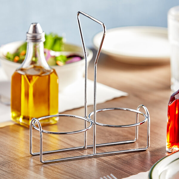A metal Choice 2-compartment condiment holder on a table.