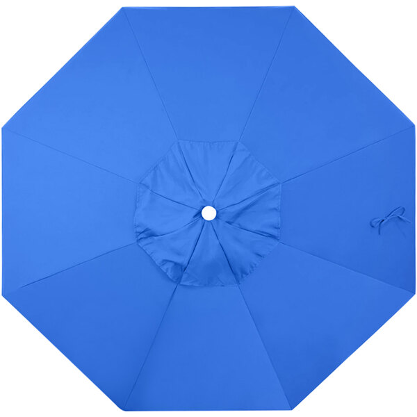A royal blue umbrella with a white circle.
