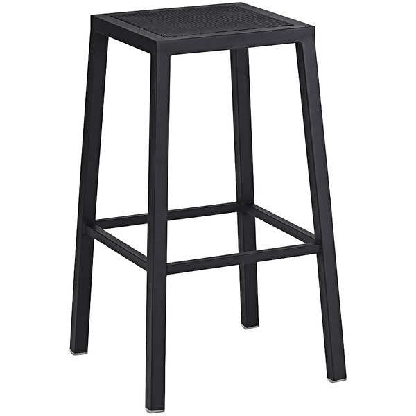 A black Holland Bar Stool backless steel mesh outdoor bar stool with a black wrinkle finish.