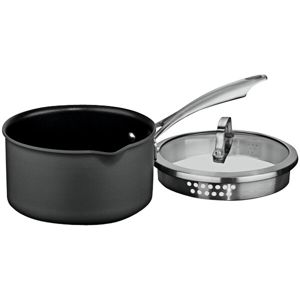 A black Cuisinart saucepan with a handle and a tempered glass lid.