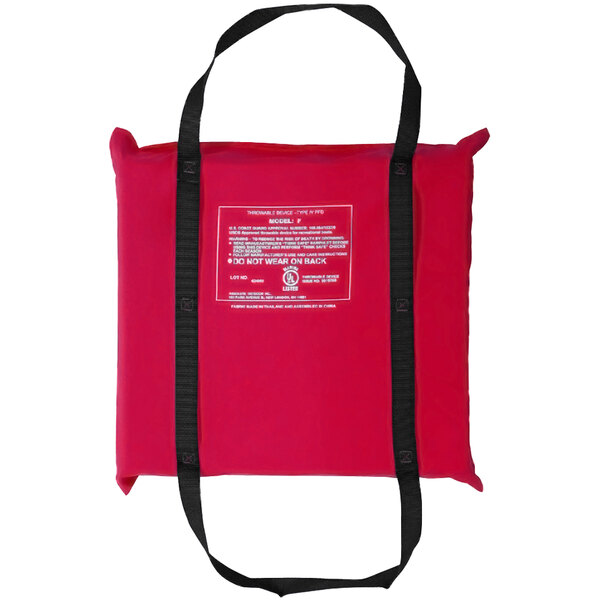 A red Kemp USA throwable foam cushion with black straps in a red bag.