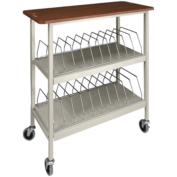 An Omnimed beige metal chart rack with cherry wood shelves and wheels.