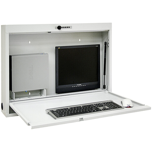 A light gray Omnimed informatics workstation with a keyboard and a monitor.