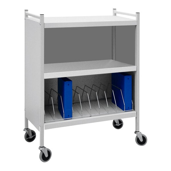 A light gray Omnimed medical cart with blue binders on wheels.