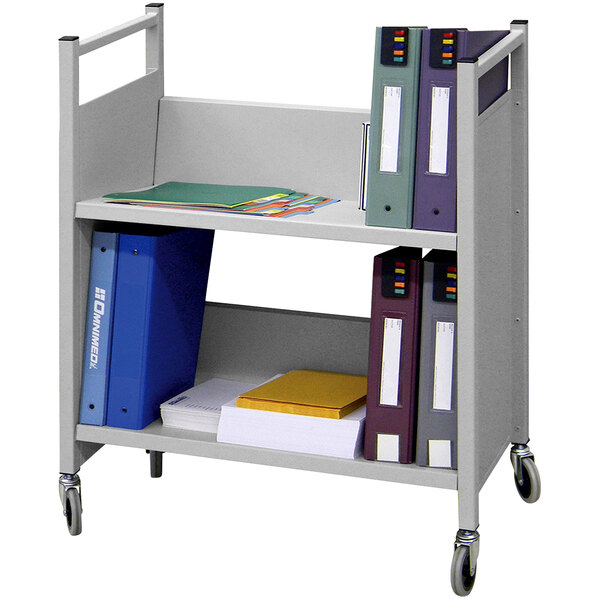 A light gray Omnimed book cart with binders and folders on it.