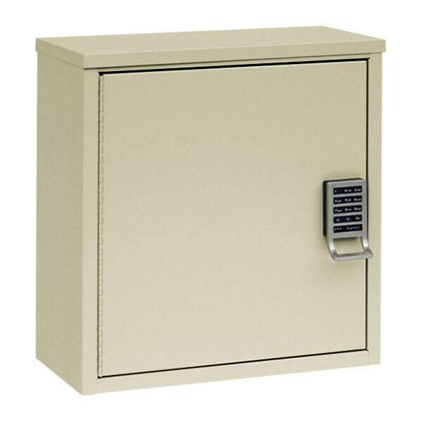 A beige metal Omnimed patient security cabinet with an electronic lock.
