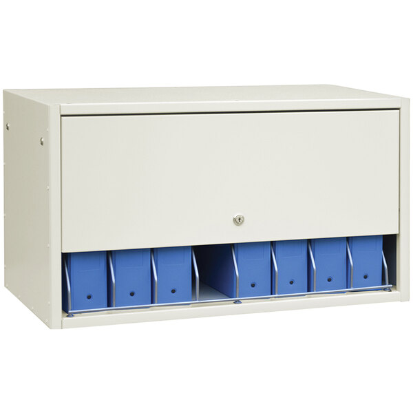 A beige Omnimed cabinet panel with blue drawers.