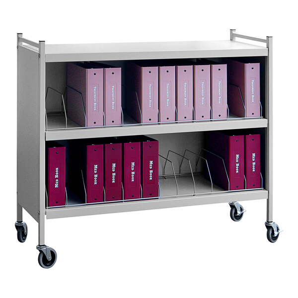 A metal cart with binders on it.